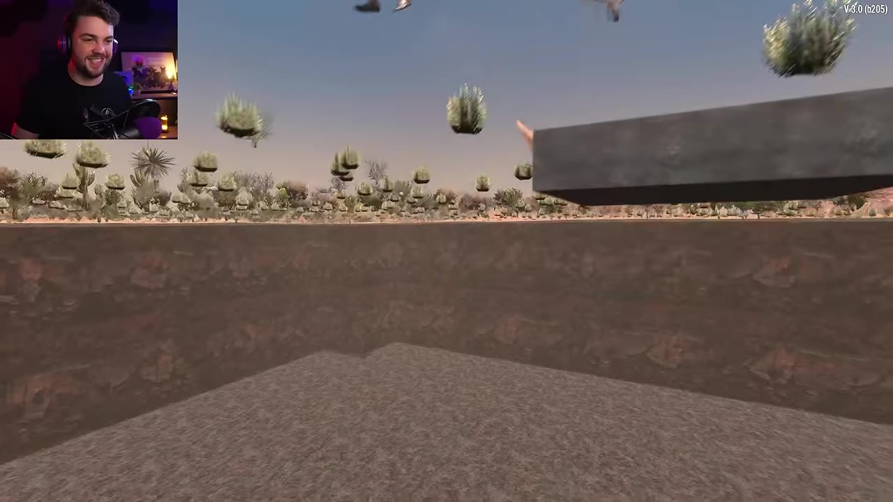 A first-person view looks out from a dug-out underground pit with dirt walls and a flat floor in a desert landscape.