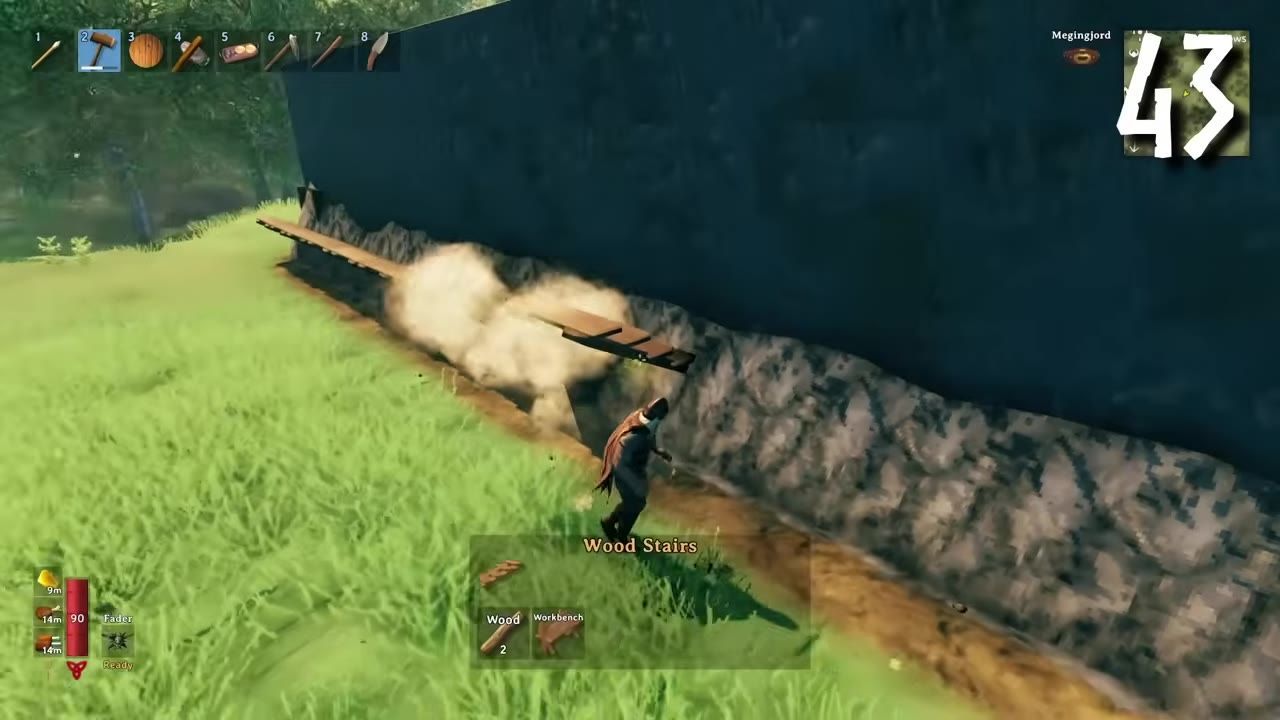 A player places wooden stairs against a defensive wall with grass around.