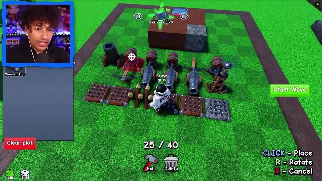 A game screenshot showing a base layout with traps, cannons, and defensive structures arranged on a square grid.