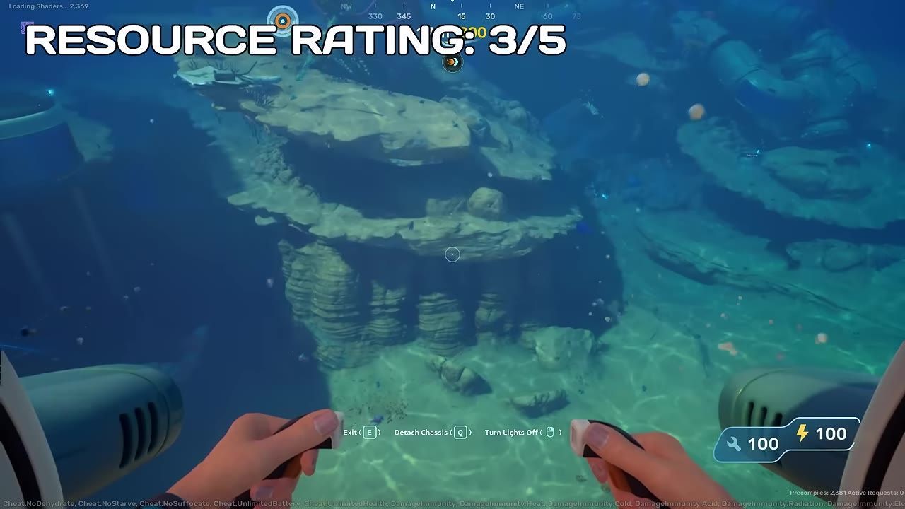 An underwater view showing rock formations with some visible resources and human hands holding controls.