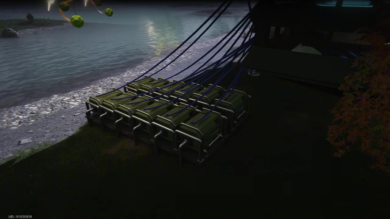 Several green pumps with connected pipes placed by the edge of a body of water.