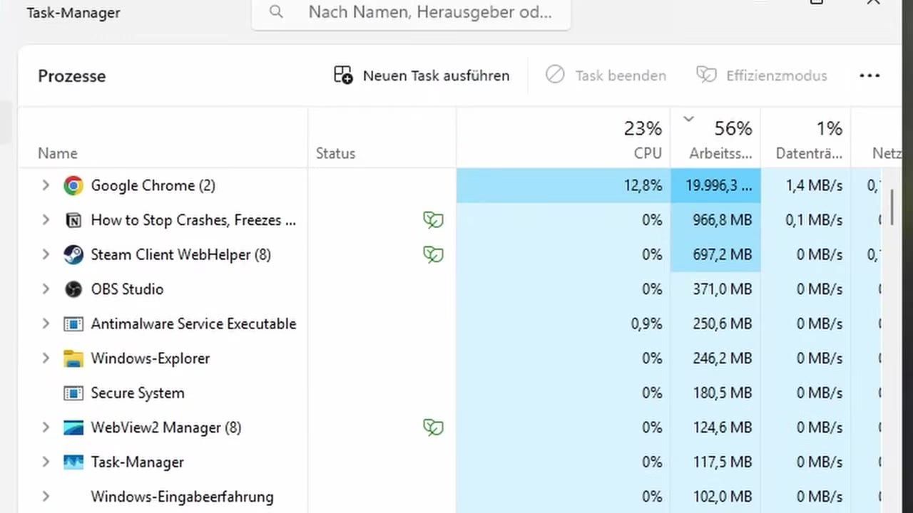 Task manager interface displaying running applications and system processes.