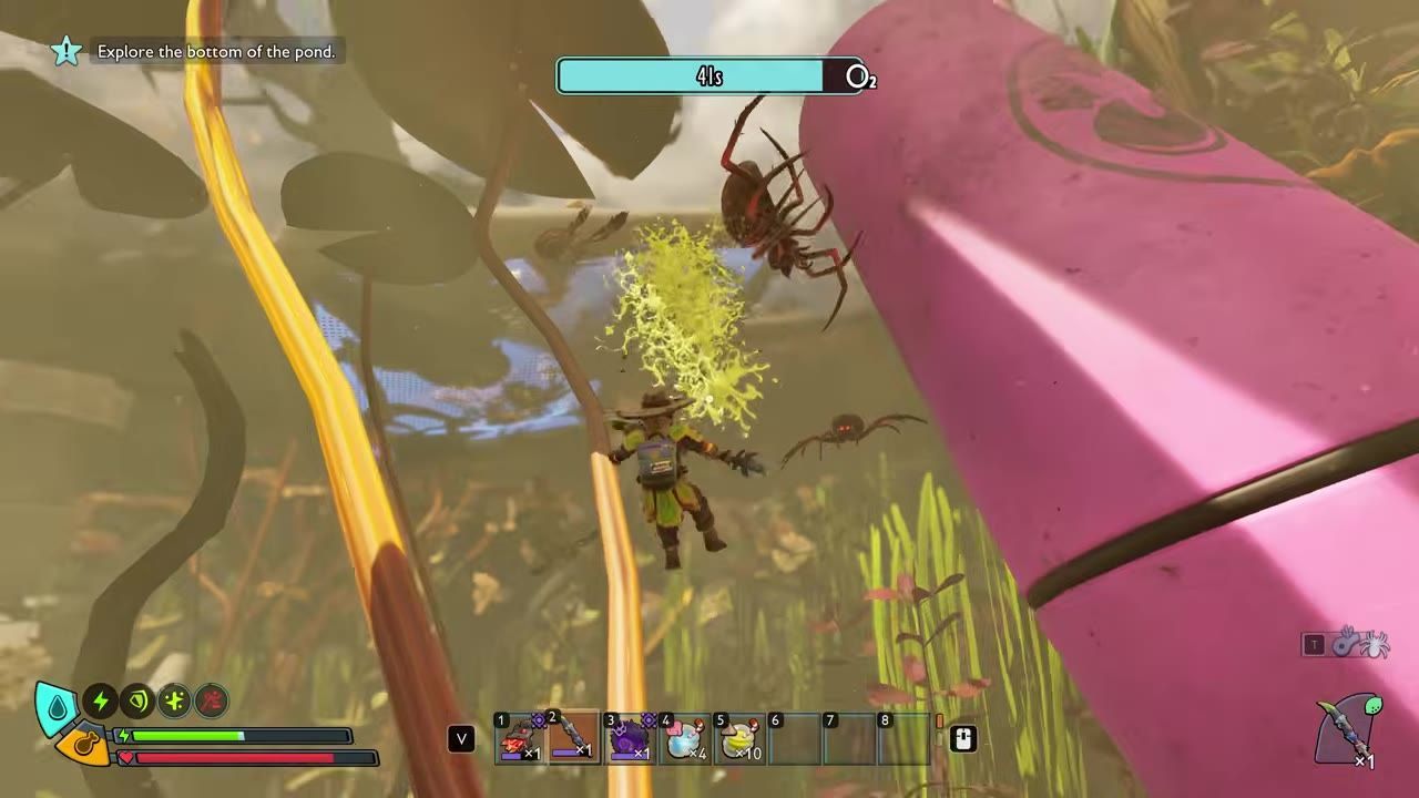 The player character attacks a spider in a dense, underwater environment using a green projectile.