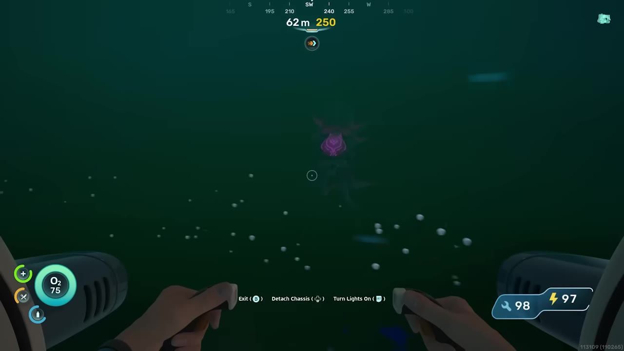 Underwater scene showing terrain and an object in the distance, viewed from a vehicle.
