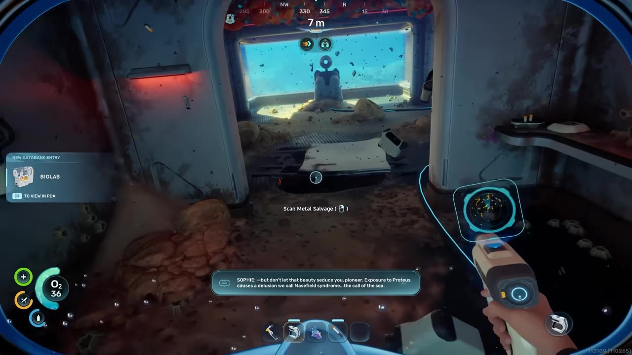 A first-person view inside a small underwater room shows a hand holding a scanning tool, a prompt to scan metal salvage, and a new databank entry for Biolab.