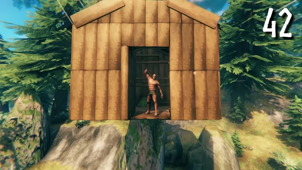 A wooden raised structure with a person standing in its doorway, surrounded by forest and rocks.