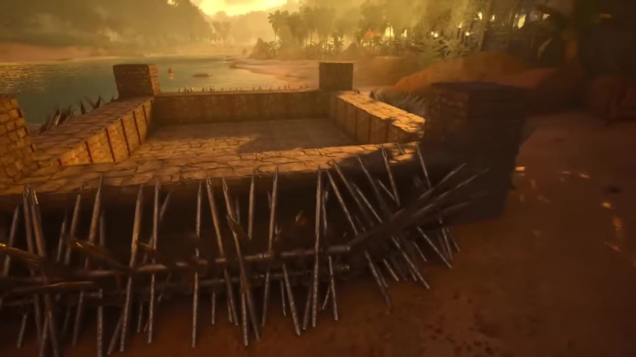 A fortified base with stone walls surrounded by sharp wooden spikes.