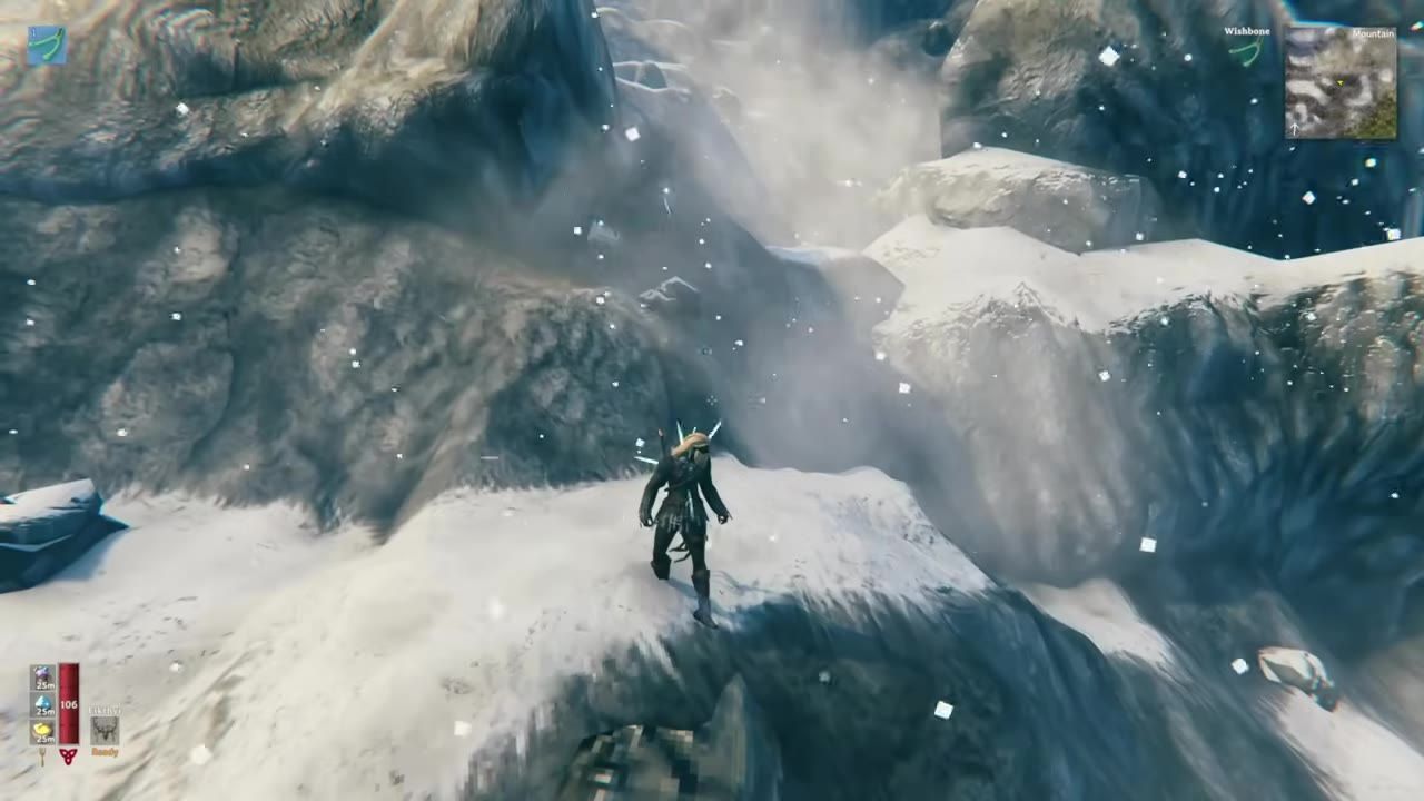 A player character stands on a snowy mountain with a wishbone active.