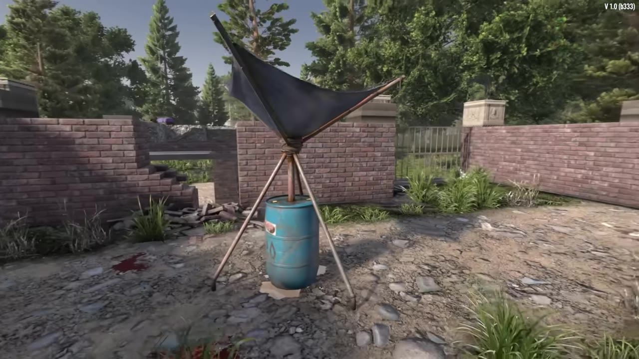 A water collection barrel set up outdoors surrounded by damaged walls and vegetation.